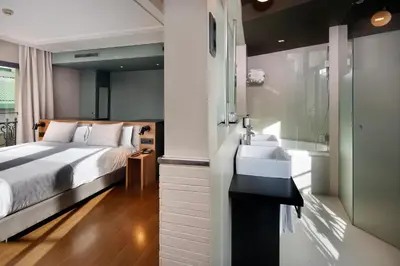a hotel room with a bed and a sink at Wilson Boutique Hotel in Barcelona
