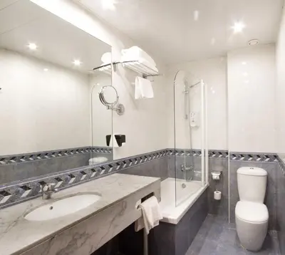 a bathroom with a sink and a shower and a toilet at Garbi Millenni in Barcelona
