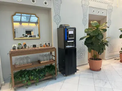 a cash register and a mirror in a room at Oriente Atiram Hotel in Barcelona