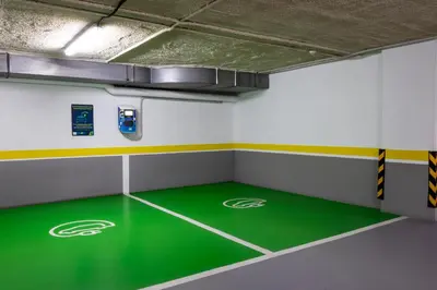 a basketball court with a green floor in a gym at Abba Garden in Barcelona