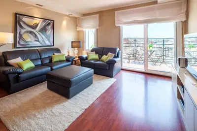 a living room with a couch and a table at Habitat Apartments Tessa in Barcelona
