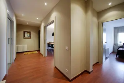 an empty hallway with a living room and a dining room at Habitat Apartments Tessa in Barcelona