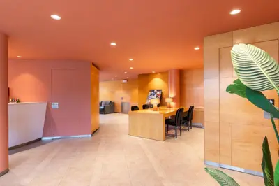 an office lobby with a table and chairs at Acta Sant Just in Sant Just Desvern