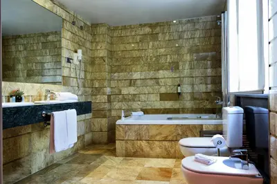 a bathroom with a tub and a toilet and a sink at ITC Barcelona By Soho Boutique in Barcelona