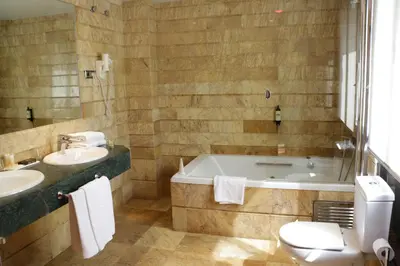 a bathroom with a tub and a sink and a toilet at ITC Barcelona By Soho Boutique in Barcelona