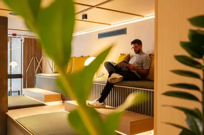 a living room with a couch in a room at Zenit Borrell in Barcelona