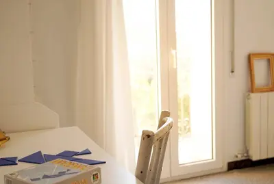 a white table with a pizza box on top of it at Habitación doble con Balcón - Casa rural compartida - Coliving in Torrellas de Foix