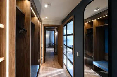 a hallway with wood paneling and glass doors at Catalonia Barcelona Plaza in Barcelona