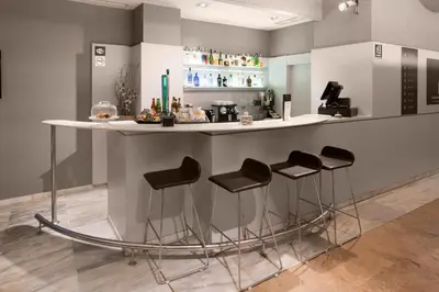 a bedroom with a bed and a flat screen tv at Catalonia Gracia in Barcelona