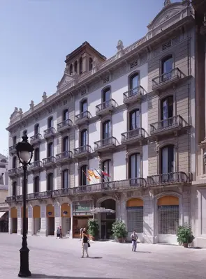 a large white building with people walking in front of it at Catalonia Portal de l'Angel in Barcelona