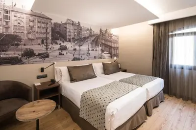 a living room with couches and a table and shelves at Catalonia Born in Barcelona