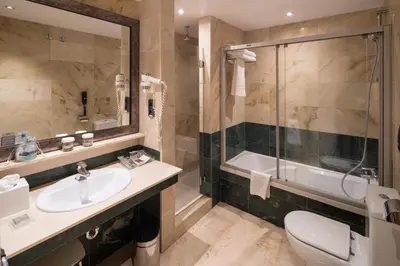 a bathroom with a sink and a shower and a toilet at Catalonia Born in Barcelona