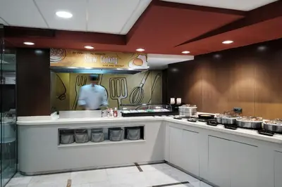 a kitchen with a counter with pots and pans at Catalonia Sagrada Familia in Barcelona