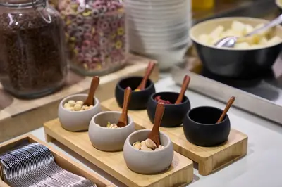 a group of small bowls of food on a table at Catalonia Castellnou in Barcelona
