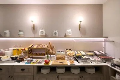 a kitchen with a counter with food on it at Catalonia Castellnou in Barcelona