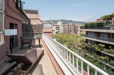 a balcony with a bench and a table on it at Catalonia Castellnou in Barcelona