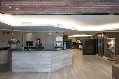 a hotel room with a bed and a television at Catalonia Albeniz in Barcelona