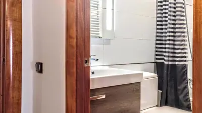 a bathroom with a sink and a mirror at Livingstone in Barcelona