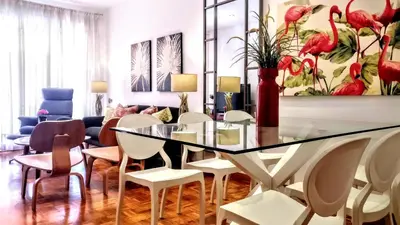 a dining room with a glass table and chairs at Livingstone in Barcelona