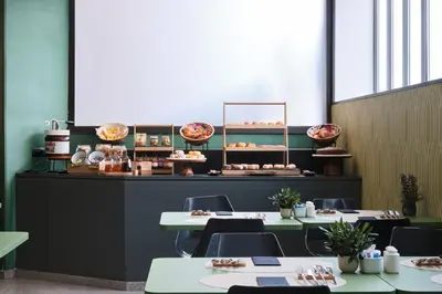 a table with two plates of food and a plate of food at Catalonia Park Putxet in Barcelona