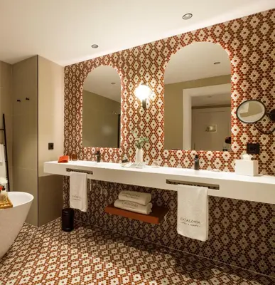 a hotel room with a bed and a table at Catalonia Barcelona 505 in Barcelona