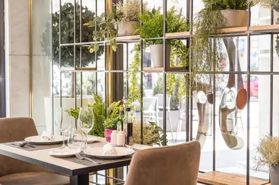 a counter with plates of food and jars of food at Catalonia Barcelona 505 in Barcelona