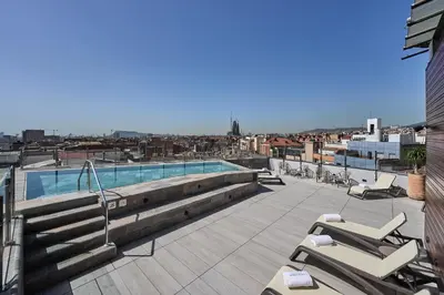 a swimming pool on the roof of a building at Catalonia Atenas in Barcelona