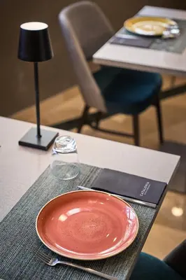 a kitchen with a person in the kitchen at Catalonia Atenas in Barcelona