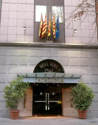 a building with flags in front of a store at Catalonia Roma in Barcelona