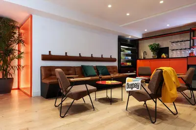 a table with a box and a bottle of orange juice at chic&basic Reding in Barcelona