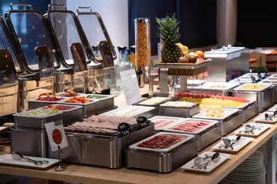 a buffet with many different types of food on display at Catalonia Sabadell in Sabadell