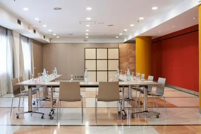 a conference room with a long table and chairs at Catalonia Sabadell in Sabadell