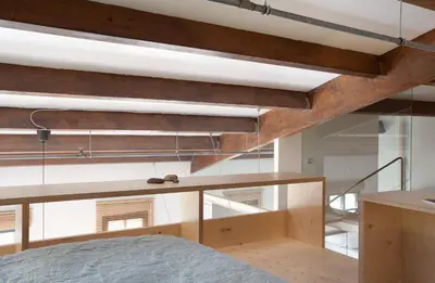 a room with a bed and a large window at Beach Loft Duplex in Barcelona