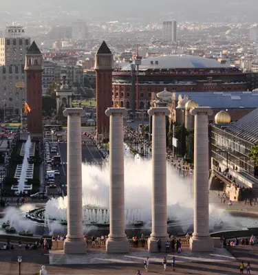 a view of a fountain with a city in the background at Barcelona Just Like Home in Barcelona