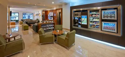 a lobby of a store with a waiting room at NH Barcelona Eixample in Barcelona