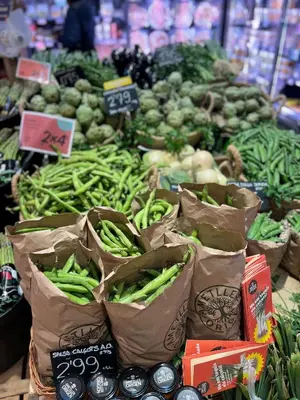 a display of vegetables in bags in a store at Apartaments-Hotel Hispanos 7 Suiza in Barcelona