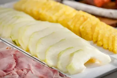 a tray of food with meat and vegetables on it at AC Hotel Irla by Marriott in Barcelona