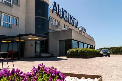 a building with a car parked in front of it at Augusta Barcelona Vallès in Granollers