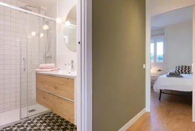 a bathroom with a sink and a shower at LETS HOLIDAYS Beach front apartment in Gavà Mar, Pine Beach in Gavà