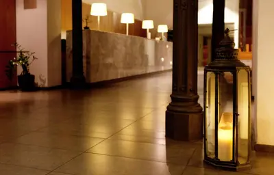 a lantern sitting on the floor next to a pole at Onix Rambla in Barcelona