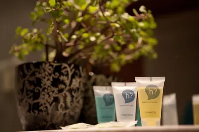 a group of three facial cleansers in front of a vase at Onix Rambla in Barcelona