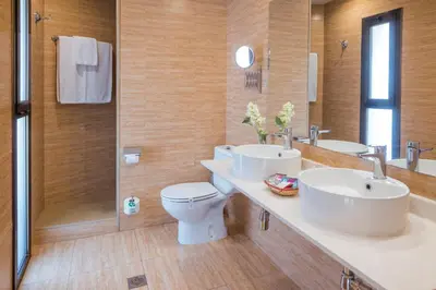a bathroom with two sinks and a shower at Sumus Hotel Stella and Spa 4S Adults Recommended in Pineda de Mar