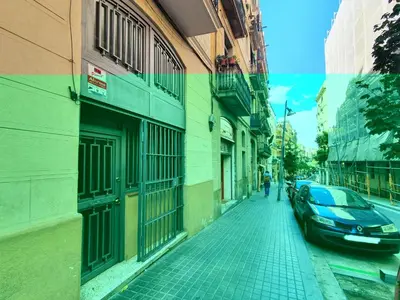 a car parked on a street next to a building at BBarcelona Dúplex Poble Sec in Barcelona
