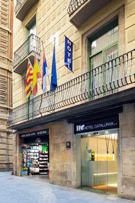 a store with flags on the side of a building at Catalunya in Barcelona