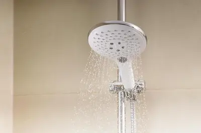 a shower head with water coming out of it at NH Barcelona Stadium in Barcelona