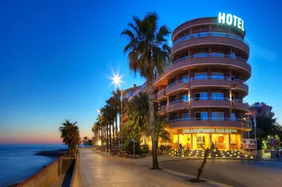 a hotel on the beach next to the ocean at Sunway Playa Golf & Spa Sitges in Sitges