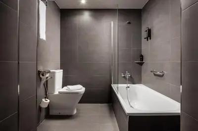 a bathroom with a toilet and a bath tub at BYPILLOW Mothern in Barcelona