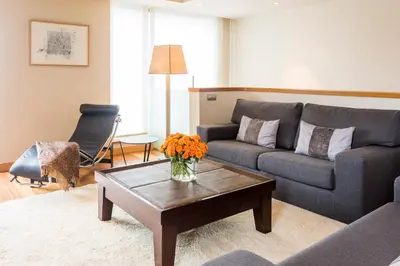 a living room with a couch and a coffee table at Majestic Hotel & Spa Barcelona GL in Barcelona