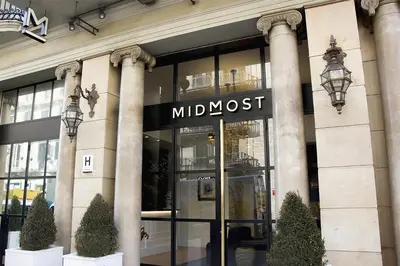 a large building with a storefront with a muppet most sign at Hotel Midmost by Majestic Hotel Group in Barcelona