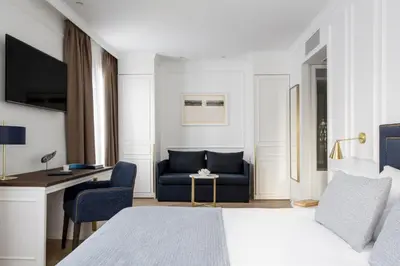 a bathroom with a shower with a glass door at Hotel Midmost by Majestic Hotel Group in Barcelona